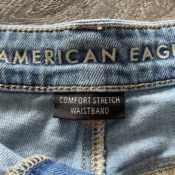 MEDIUM WASH AMERICAN EAGLE HIGH WAISTED DISTRESSED COMFORT STRETCH DENIM SHORTS - Picture 2 of 4